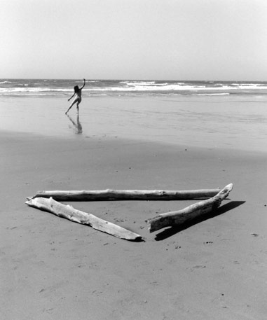 black and white photo woman on the beach